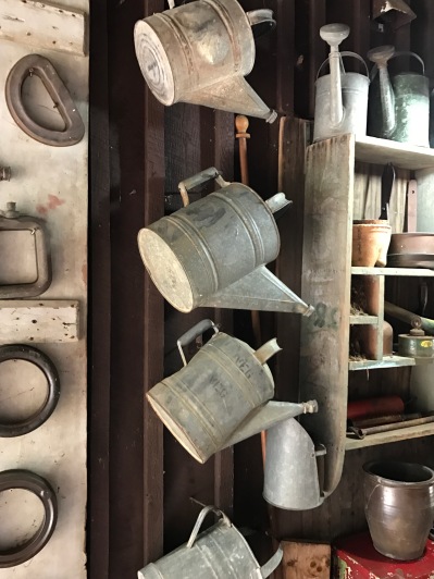 Retired watering cans.